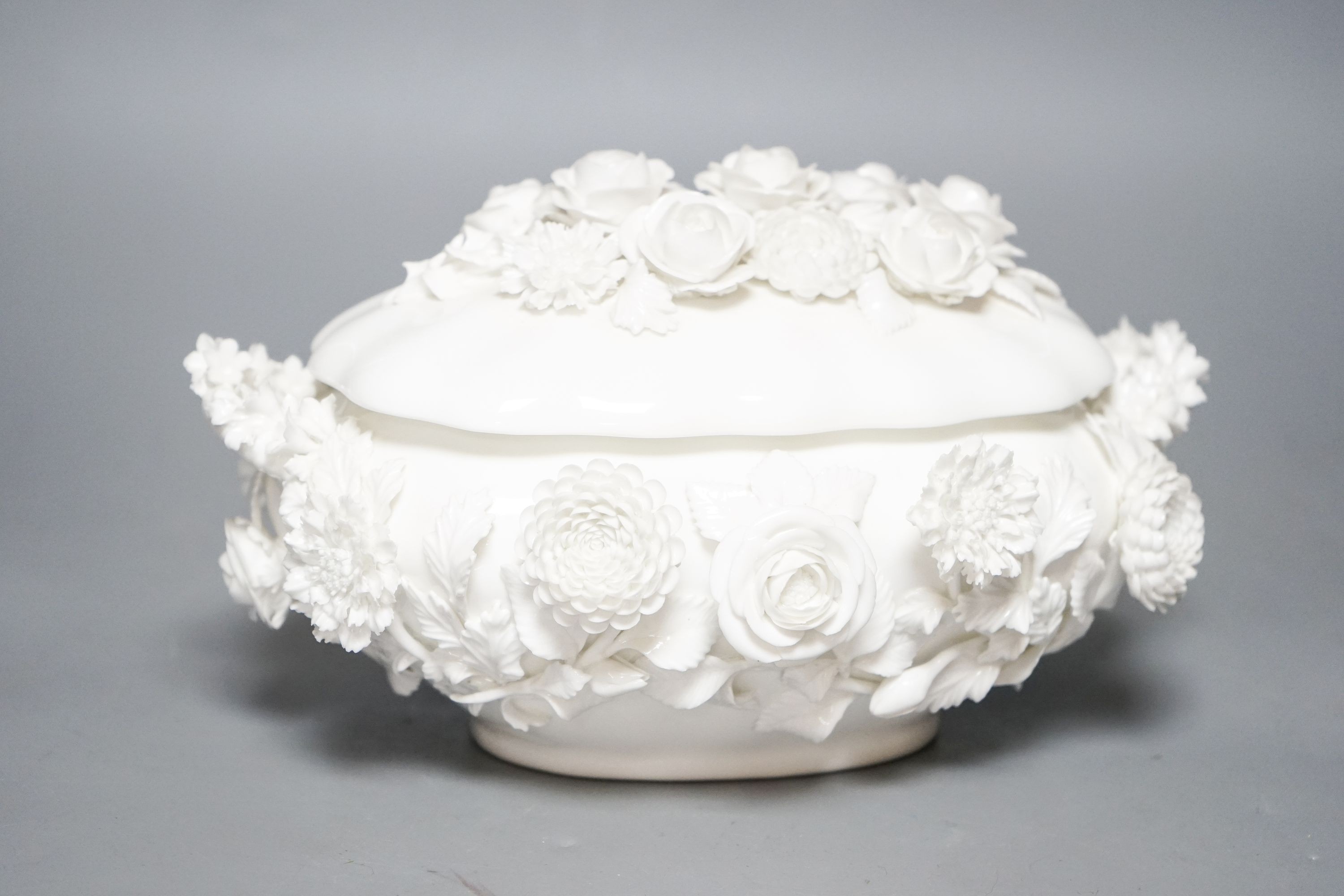 A Coalbrookdale by Coalport white glazed porcelain floral encrusted bowl and cover 23cm